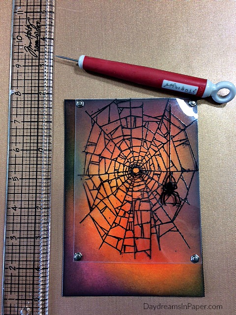 Spider Web Image Stamped on Plastic Attached with Brads